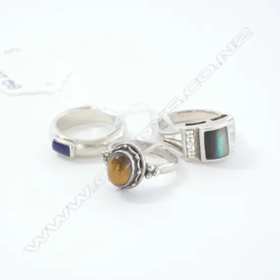 THREE STERLING SILVER RINGS WITH GEMSTONES