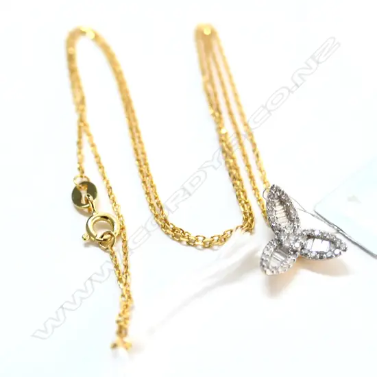 18cT Y/GOLD 40 DIAMOND PENDANT. INS. $960. SIL.GILT CHAIN