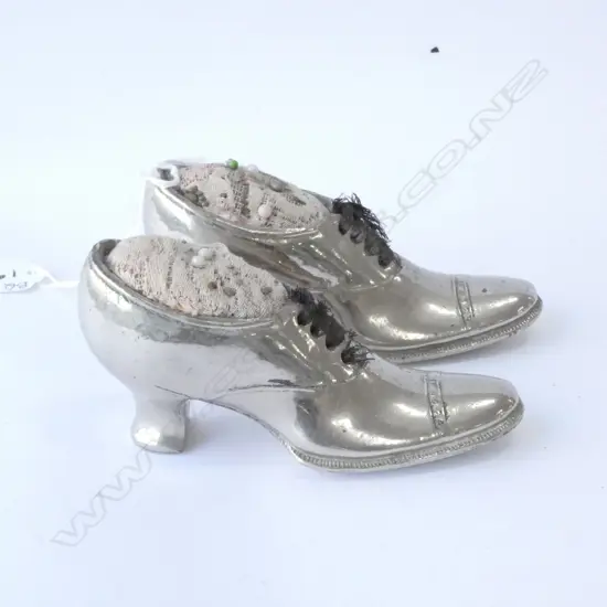 PAIR SILVER PLATED SHOE PIN CUSHIONS, L. 135MM