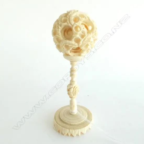 SMALL CARVED IVORY PUZZLE BALL ON STAND