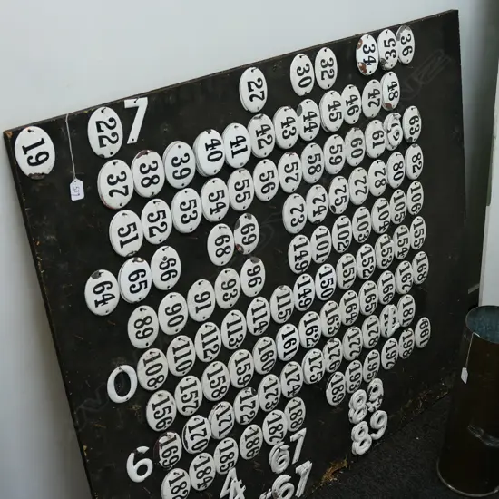 COLLECTION OF VINTAGE ENAMEL NUMBERS ON PLY BOARD 1200MM H