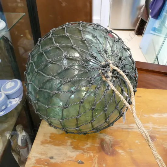 OLD LARGE GLASS FISHING FLOAT WITH NETTING