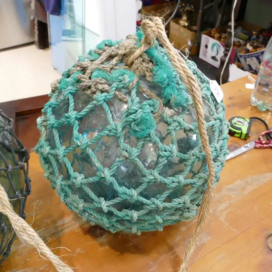 OLD LARGE GLASS FISHING FLOAT WITH NETTING