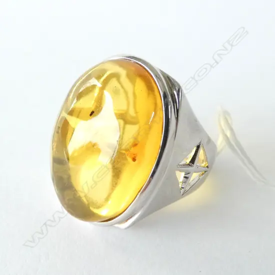 SILVER MOUNTED LGE AMBER INSECT RING