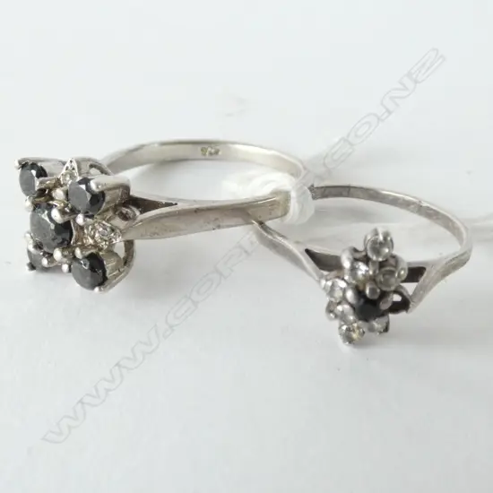 PAIR STONE & CZ'S RINGS, ONE HAS SMALL STONE MISSING.