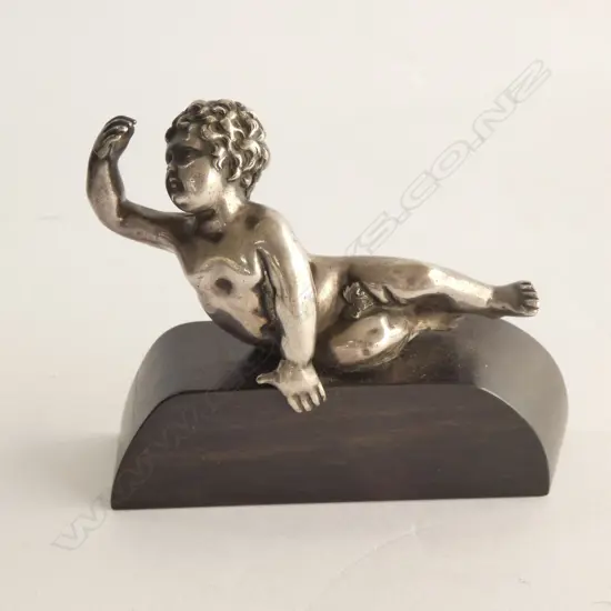 ANTIQUE SILVER FRENCH SMALL CHERUB ON EBONY STAND