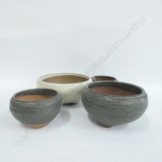 FOUR ROUND BONSAI POTS, LARGEST DIA. 190MM