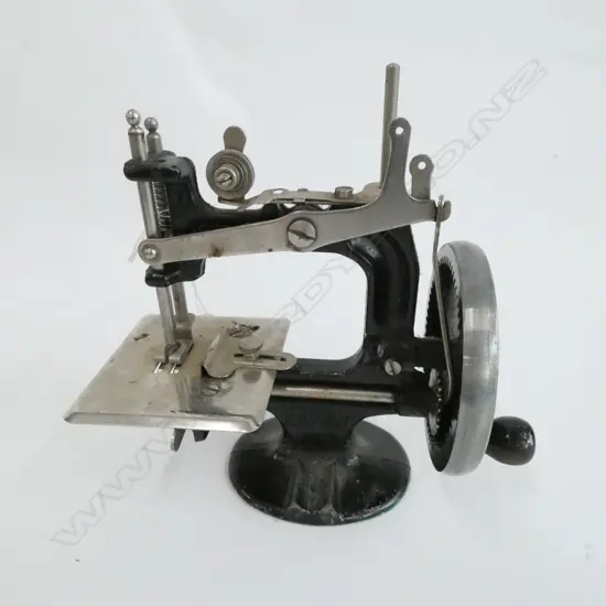 CHILD'S MINIATURE PETER PAN SEWING MACHINE, H. 175MM