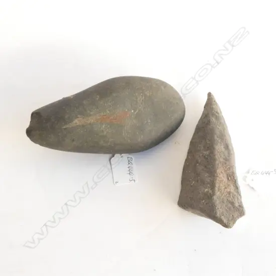 2 UNUSUAL FORM WORKED ? STONES. L.170mm