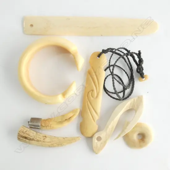 7 ITEMS: SILVER CAPPED TOOTH PENDANT. BONE PENDANTS ETC