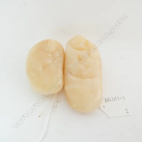 PAIR OF HANDLING STONES WITH CARVED BUDDAH, L 95MM