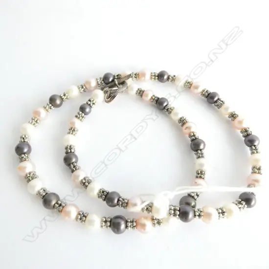 A STRING OF KATALI LUSTER AND BLACK PEARLS WITH STERLING SILVER DIVIDERS AND CLASP 