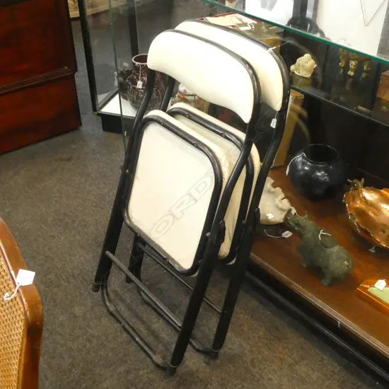 2 FOLDING VINYL COVERED CHAIRS