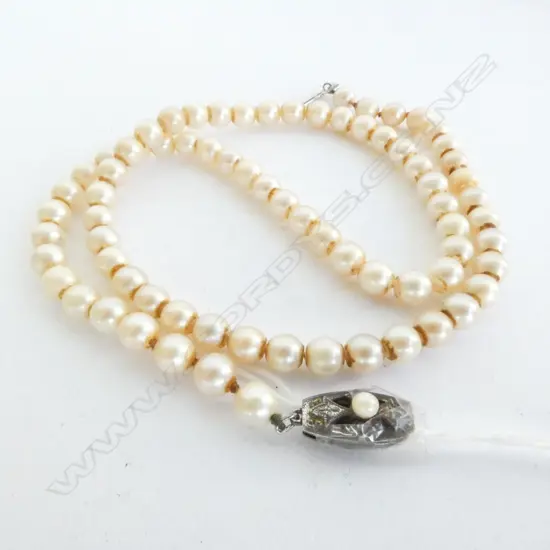 MIKIMOTO PEARLS, SINGLE STRAND, STERLING SILVER CLASP STAMPED WITH THE FAMOUS 'M', 480mm