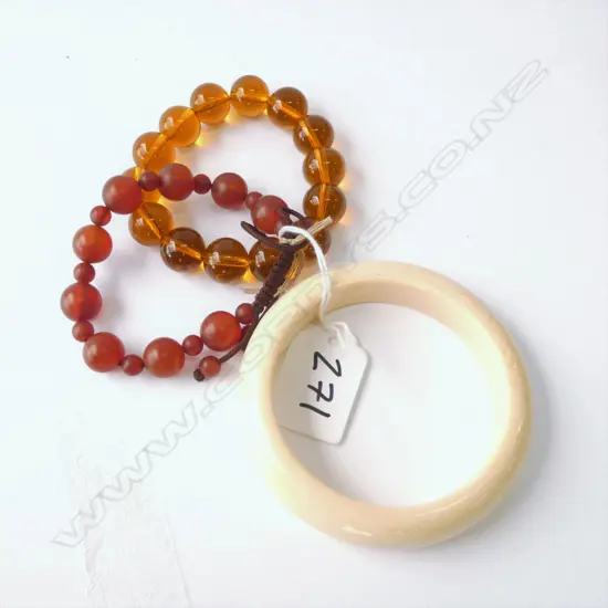 TWO  BRACELETS; AMBER & JADE REPLICA & FAUX IVORY BANGLE