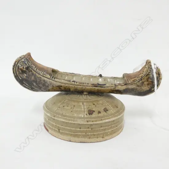 NZ STUDIO POTTERY GREIG BARNETT - SCULPED CANOE ON STAND D140MM