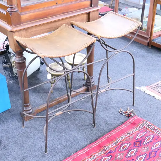 A PAIR OF LEATHER TOPPED STOOLS 