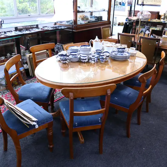 KAURI OVAL TABLE GLASS TOP L. 1800MM W. 1150MM + 7 BLADE BACK CHAIRS 