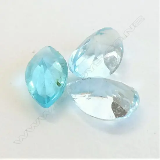 THREE BLUE TOPAZ OR AQUAMARINE GEMSTONES 