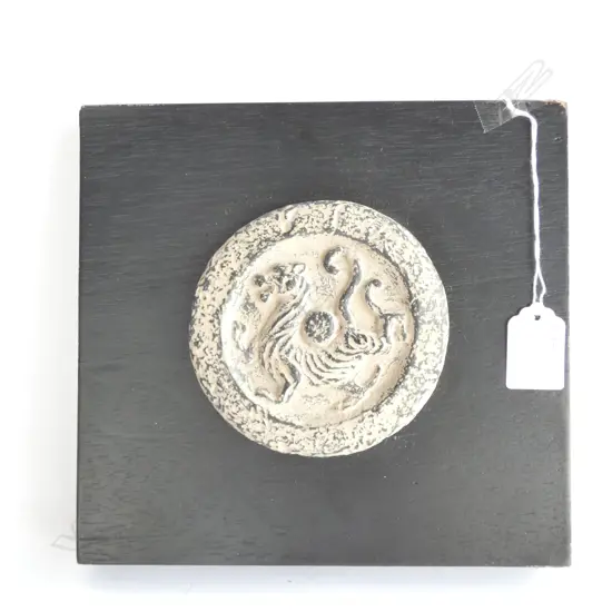 CHINESE WALL PLAQUE. POTTERY?DISC ON BLACK PANEL