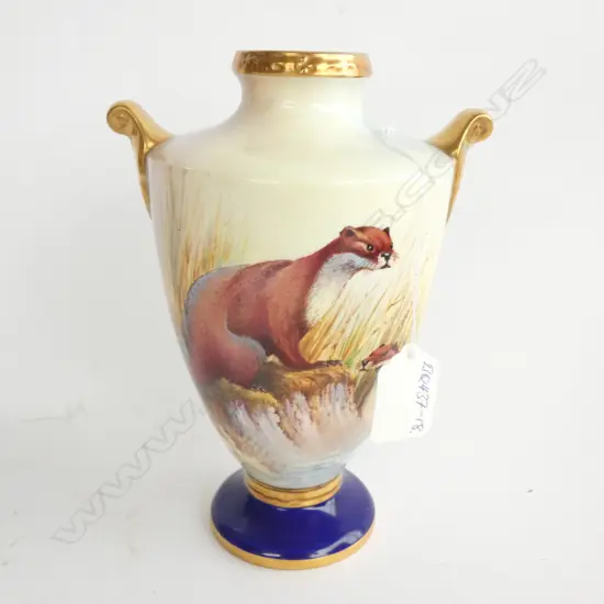 H.190mm. Baluster urn form. Gilt highlights. Detailed panel to reverse. H