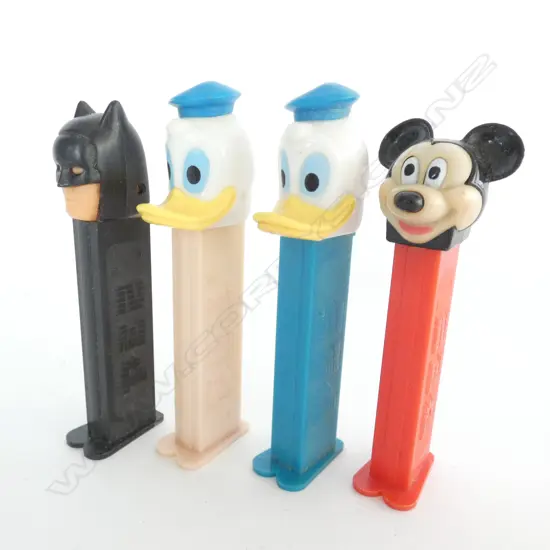4 PEZ CANDY DISPENSERS; 2 DONALD DUCK, 1 MICKEY MOUSE, 1 BATMAN