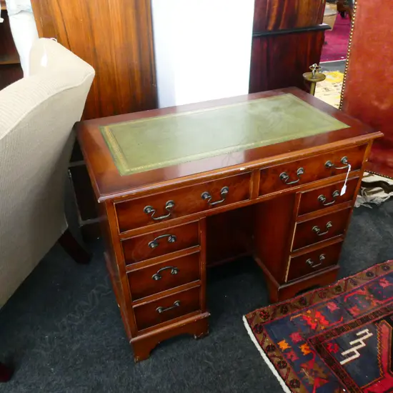 LEATHER TOPPED DESK H. 760MM W. 910MM