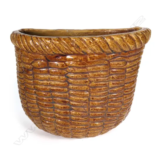 A vintage French glazed terracotta large wall basket,