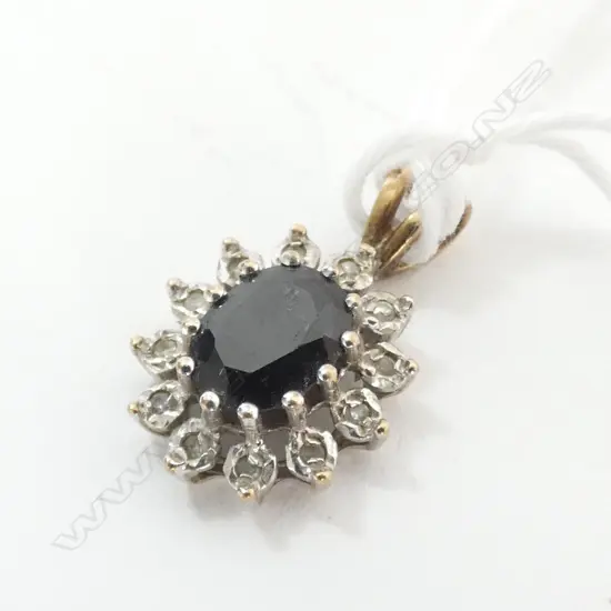 PENDANT, SAPPHIRE SURROUNDED BY 12 DIAMONDS SET IN 9ct GOLD, APPEARS TO BE LONDON, 1924(?), MAKER A.T LD