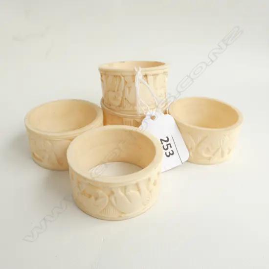 5 CARVED IVORY NAPKIN RINGS