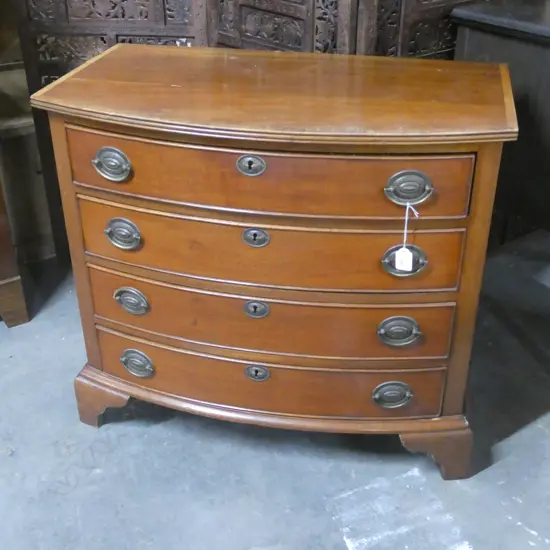 BOW FRONT CHEST OF DRAWERS H. 750MM W. 845MM