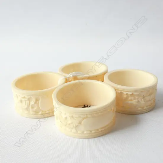 4 CHINESE IVORY CARVED NAPKIN RINGS WITH DRAGON DECORATION