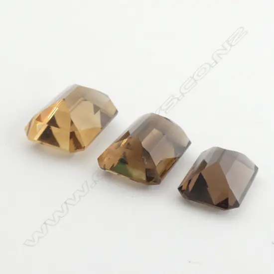 THREE UNSET SMOKY QUARTZ STONES