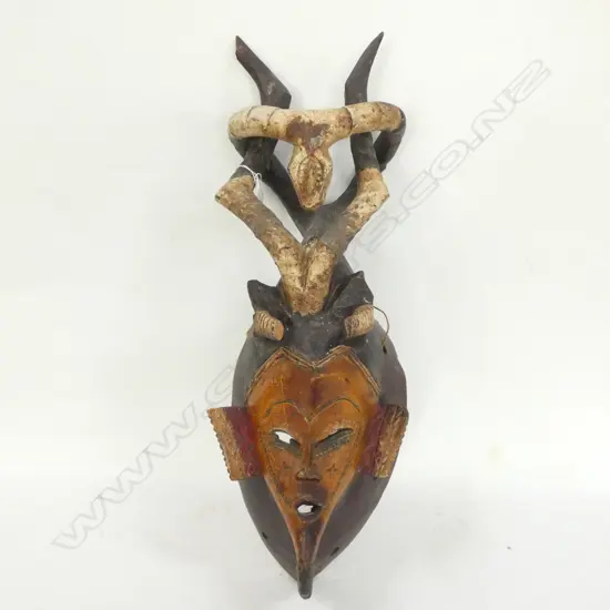 TRIBAL AFRICAN CARVED WOODEN MASK WITH ENTWINED HORNS - H. 600MM