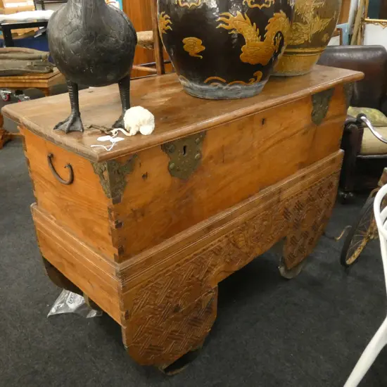 LARGE CARVED ORIENTAL CHEST ON WHEELS...