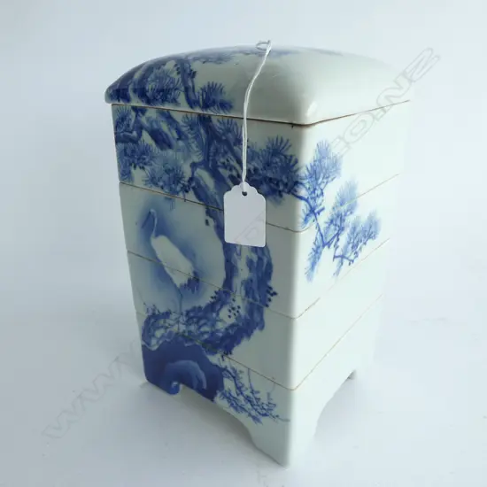 MEIJI-PERIOD 5 SECTION IMARI ‘JU-BAKO’ FOOD PRESENTATION BOX. hand painted in blue & white. A ‘Tsuru’  Crane is perched on the base of an artfully rendered ‘Akamatsu’  Red Pine