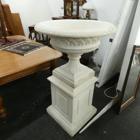 LARGE URN ON PLINTH...