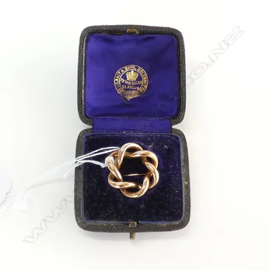 BOXED 9ct GOLD CIRCLET BROOCH IN D.C.RAIT & SONS, GLASGOW MARKED BOX 4.1gm