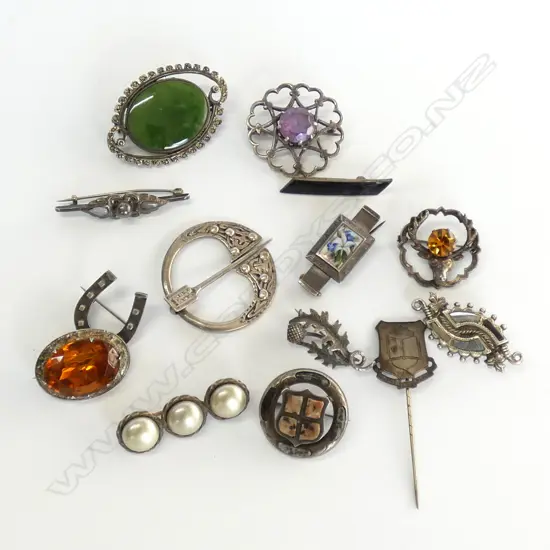 BAG OF SILVER BROOCHES