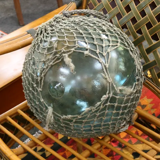 OLD LARGE GLASS FISHING FLOAT WITH NETTING