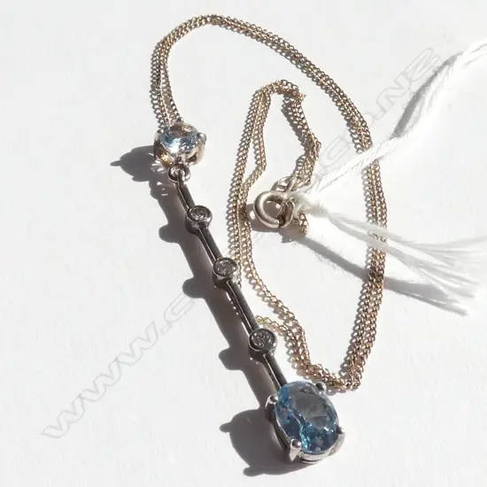 SILVER LONG PENDANT ON CHAIN PALE BLUE STONES