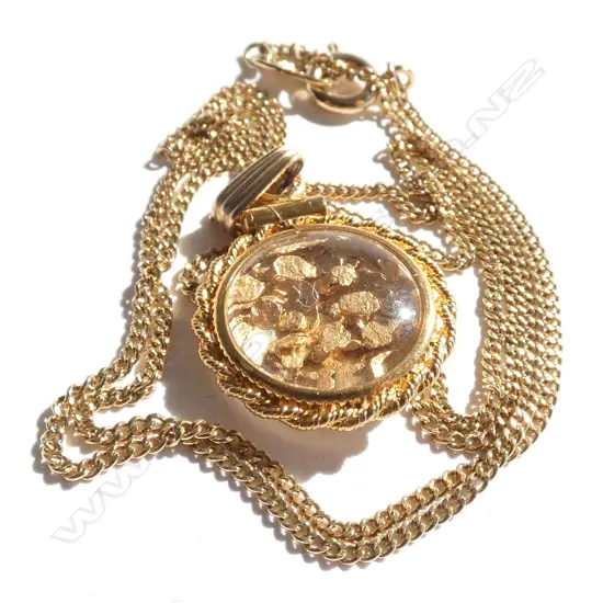 GOLD FLAKE ENCASED GILT PENDANT ON CHAIN