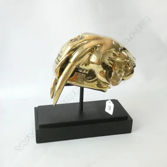 POLISHED BRONZE SABRE TOOTH TIGER SKULL ON STAND