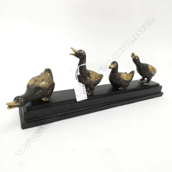 FOUR BRONZE DUCKS ON EBONISED BASE L.375mm. H.130mm