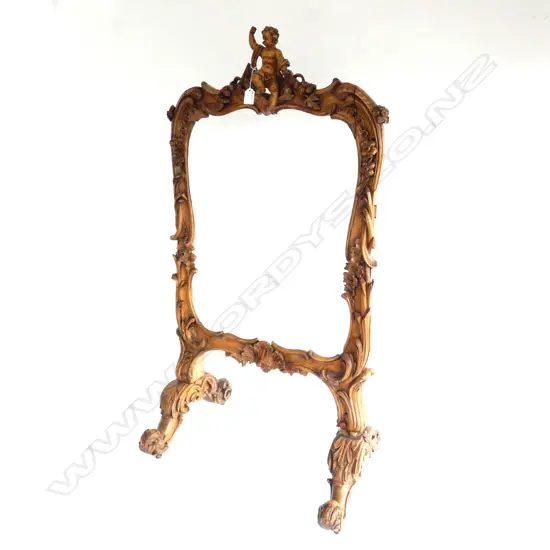 ORNATELY CARVED WOODEN FIRESCREEN FRAME W. 600MM H. 1100MM