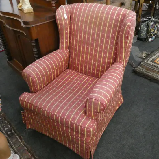 RED UPHOLSTERED ROCKING WINGBACK CHAIR