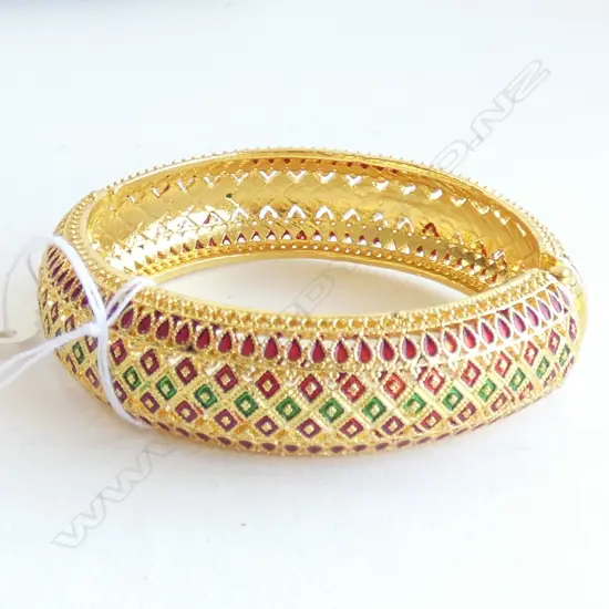 GILT & ENAMELLED EGYPTIAN STYLE HINGED BANGLE