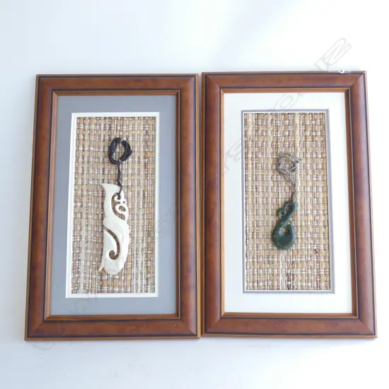 PR FRAMED MAORI POUNAMU NECKLACES - 1 GREENSTONE (?) & 1 BONE(?) BOTH SET ON WOVEN BACKGROUND  390 X 245MM INC. FRAME