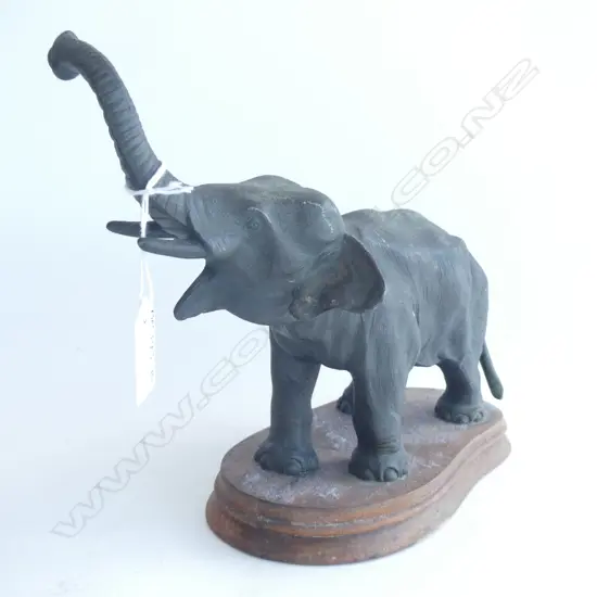 BRONZED SPELTER  ELEPHANT ON WOODEN STAND (L250MM)
