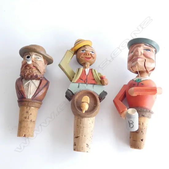 3 VINTAGE GERMAN HARD CARVED BOTTLE STOPPERS; 2 w. MOVEMENT